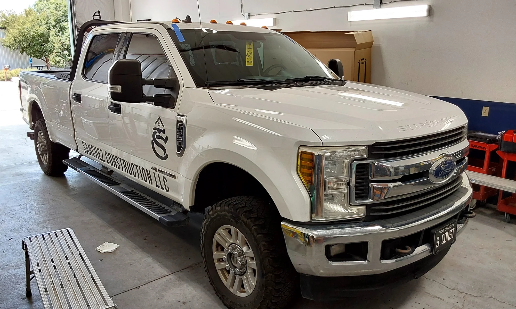 Ford Super Duty windshield replacement, Sanchez Construction